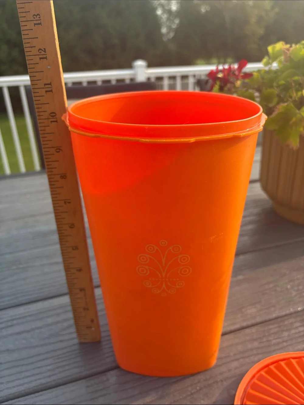 Tupperware Orange Storage Container with Decorative Emblem